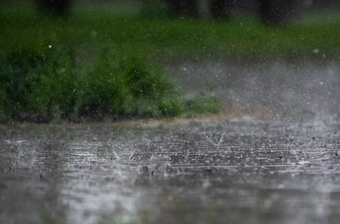 Heavy rain and hail falling on pavement during a Missouri spring storm