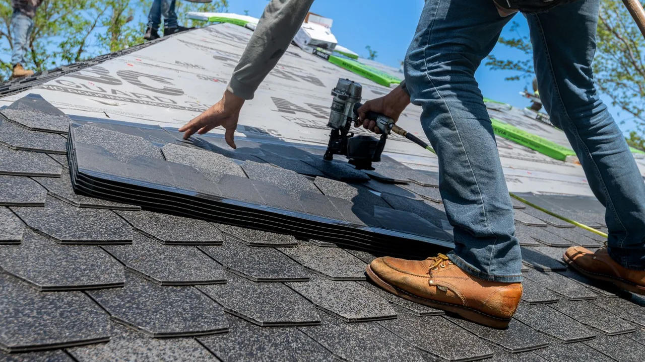LSL Roofing crew fastening architectural asphalt shingles on a Lake Saint Louis roof