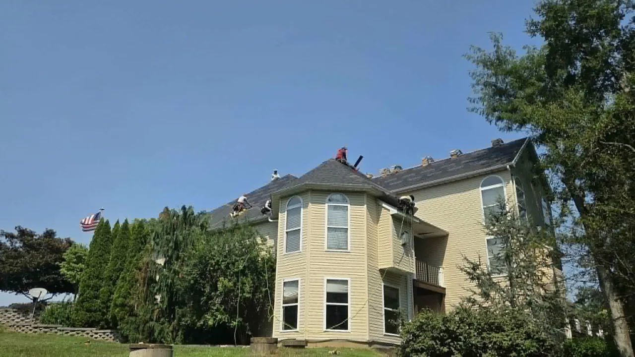 LSL Roofing crew replacing a roof on a St. Charles County home